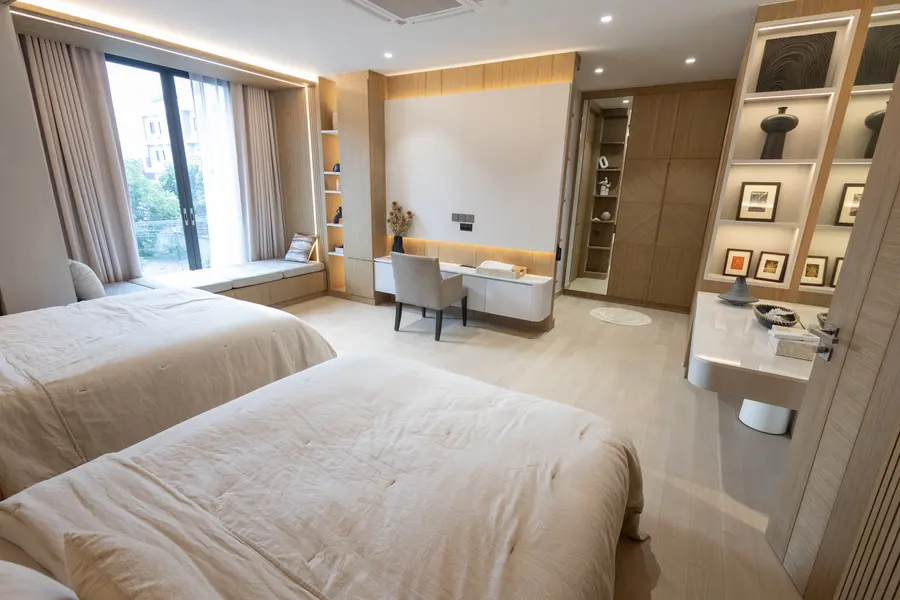 Bedroom with large windows and built-in desk