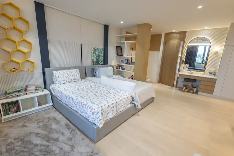 Family bedroom with built-in seating and storage