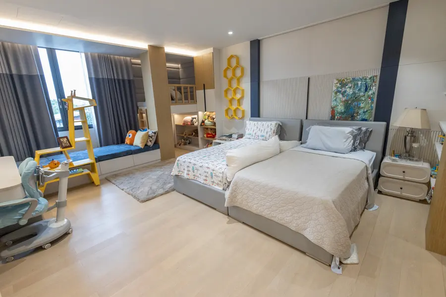 Wide bedroom view with custom built-in cabinetry