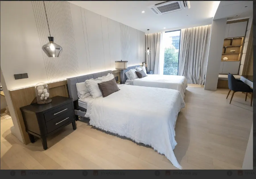 Guest bedroom with built-in desk and storage